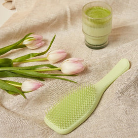 TANGLE TEEZER Plant-Based Ultimate Detangler Brush in use on wet hair