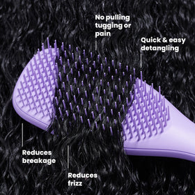 TANGLE TEEZER Ultimate Detangler brush in use on curly hair