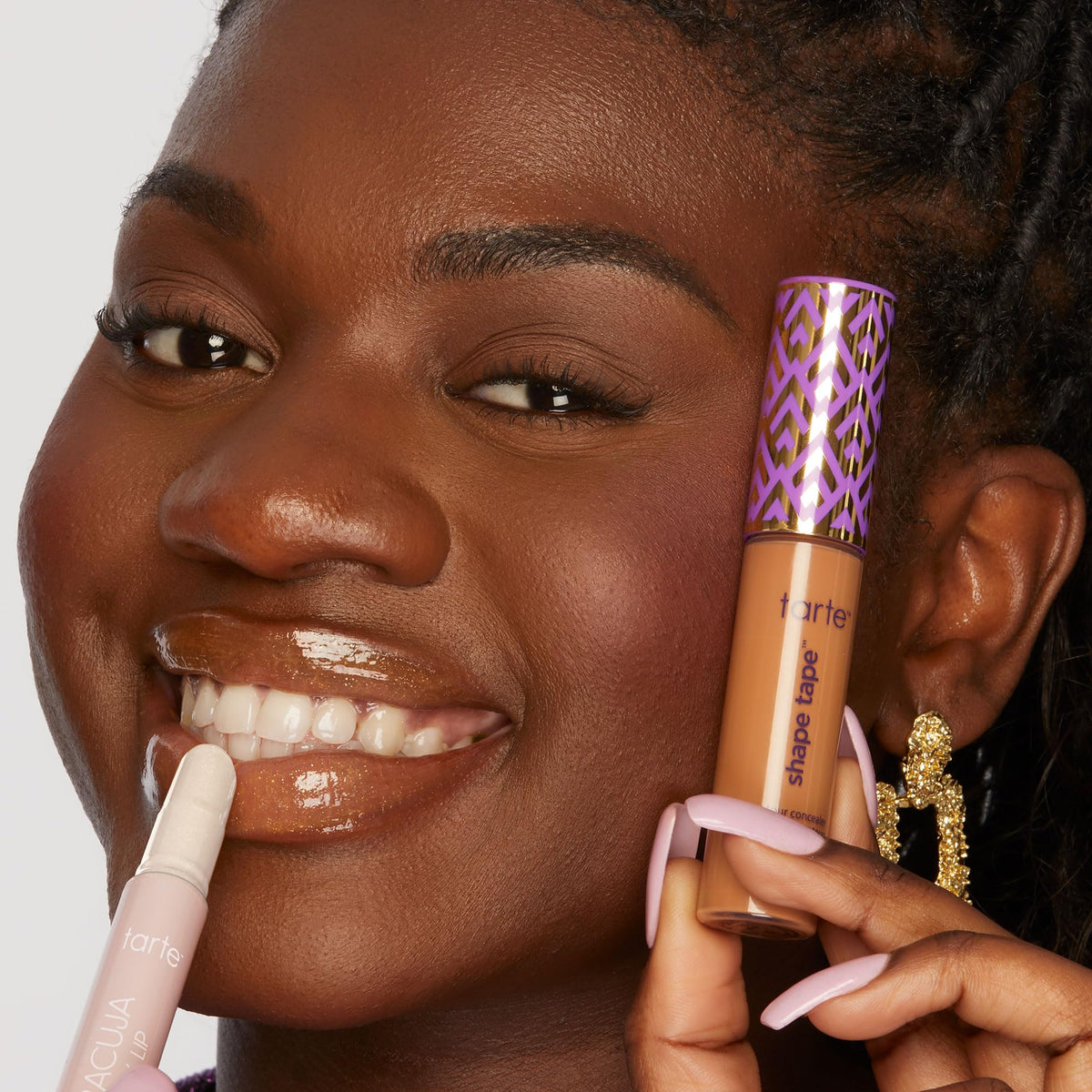 tarte Icons set with lip balm and concealer in use