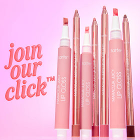 tarte Maracuja Juicy Lip Gloss displayed on a vanity