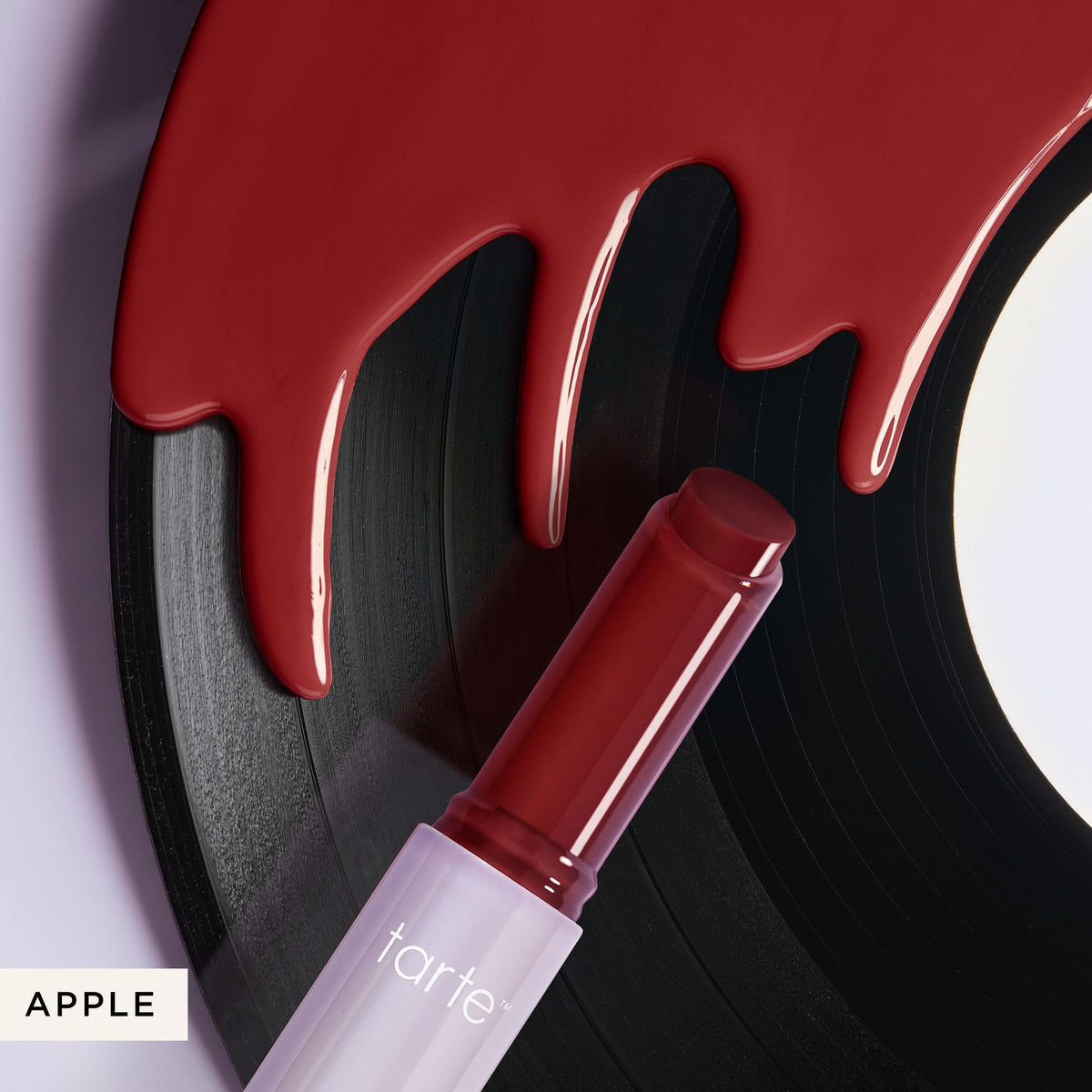 tarte Maracuja Juicy Lip Vinyl Gloss apple flavour in beauty setup
