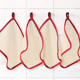Tatuo Exfoliating Washcloth displayed on a bathroom counter
