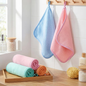 Tatuo Exfoliating Washcloths being used in a shower