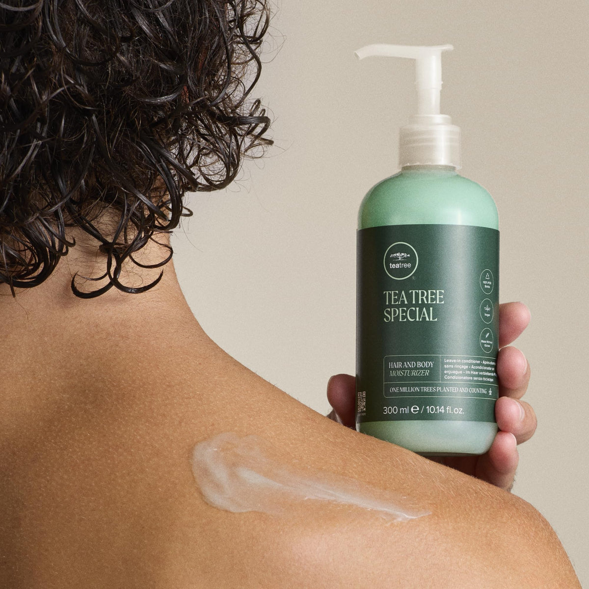 Tea Tree Hair and Body Moisturizer on a bathroom shelf