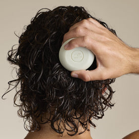 Tea Tree Special Shampoo Bar in use, lathering on hair