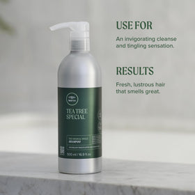 Tea Tree Special Shampoo bottle in a refreshing setting