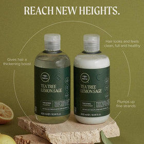 Tea Tree Thickening Shampoo bottle with citrus and herbal elements