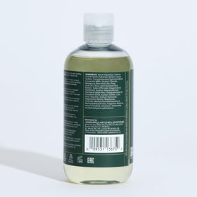 Tea Tree Thickening Shampoo with a close-up of the cap
