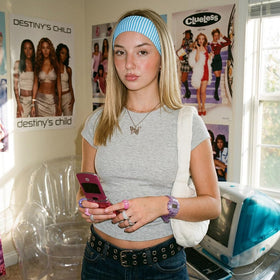 TERSE Stripe Headband in khaki on a model's head