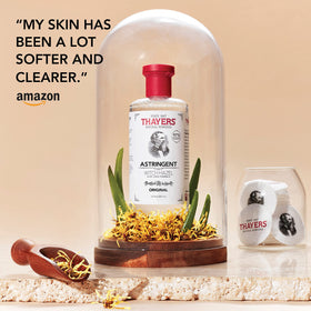 THAYERS Original Witch Hazel Astringent with Aloe Vera on a vanity