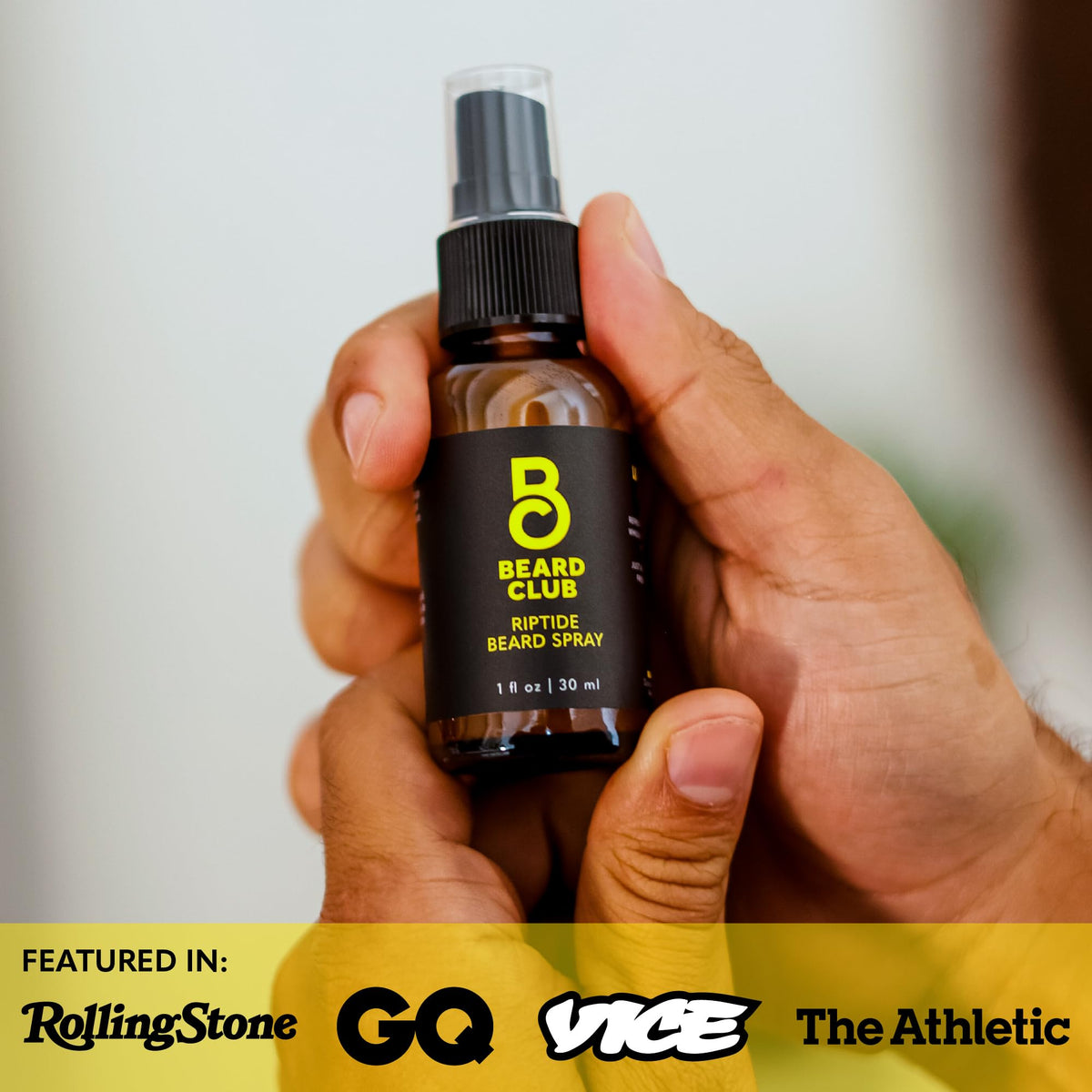 The Beard Club Riptide Beard Softening Spray on a wooden table