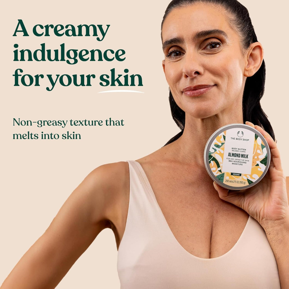 The Body Shop Body Butter Almond Milk 200ml on a wooden surface