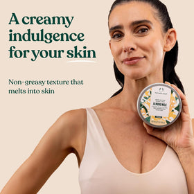 The Body Shop Body Butter Almond Milk 200ml on a wooden surface