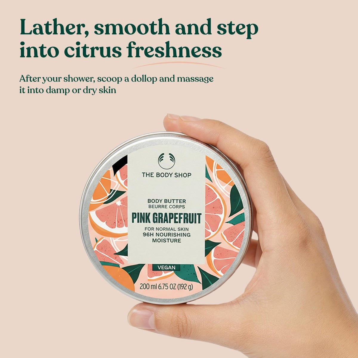 The Body Shop Pink Grapefruit Body Butter on a wooden table