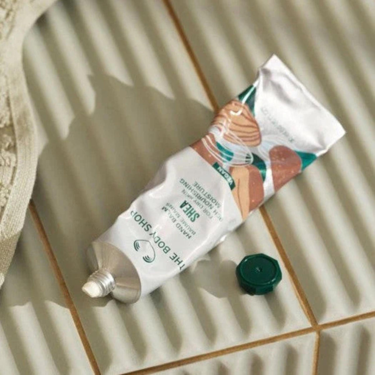 The Body Shop Shea Hand Balm in a handbag