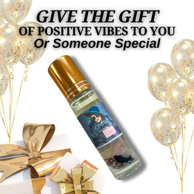 The Goddess of Flame Roll-On Oil 10ml with a candle and herbs for rituals