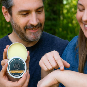 The Ilex Wood Calendula Natural Salve 100ml in a bathroom setting
