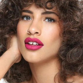 The Lip Bar Nonstop Liquid Matte Lipstick Fuchsia with lip care duo