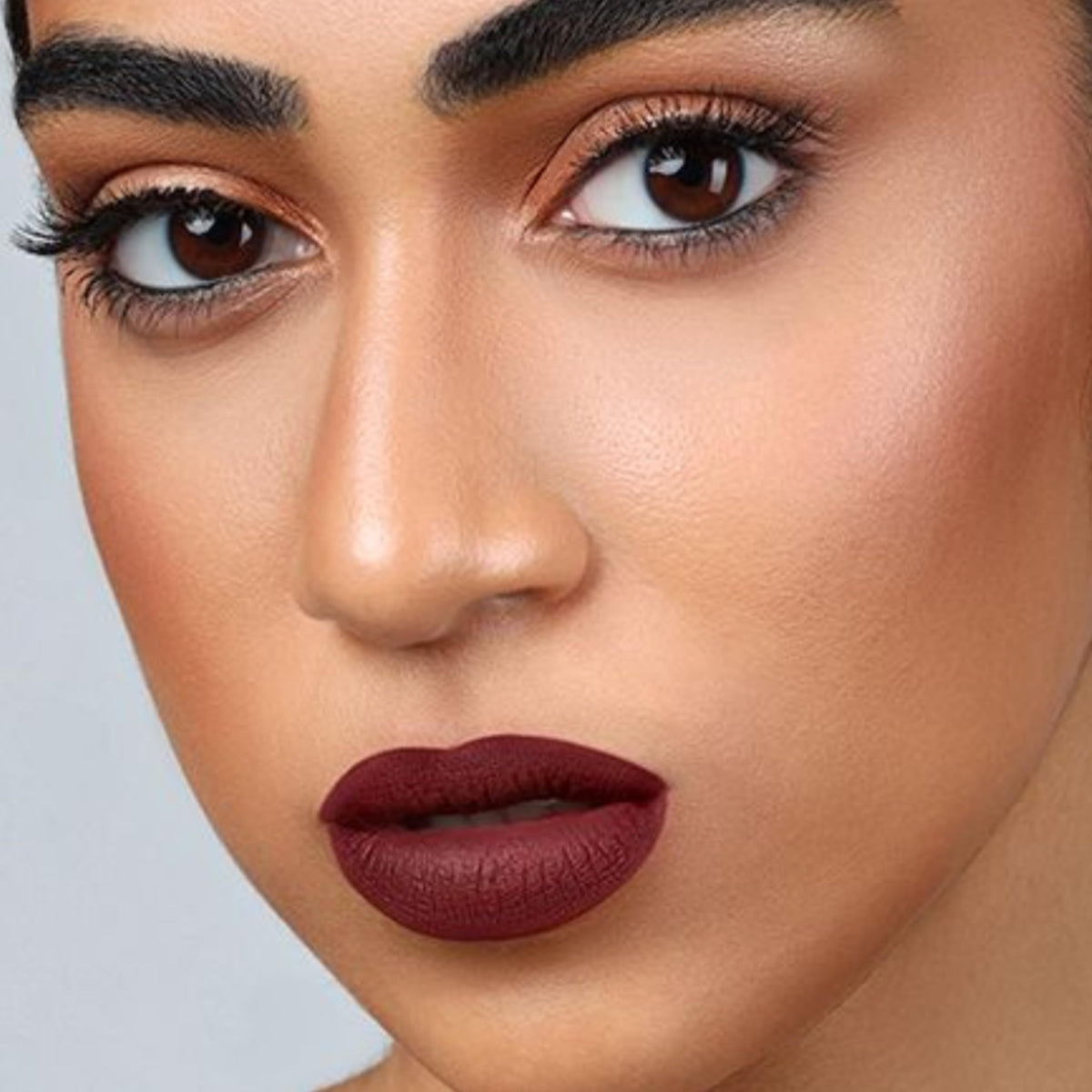 The Lip Bar Nonstop Liquid Matte Lipstick Rebel Deep Burgundy on model