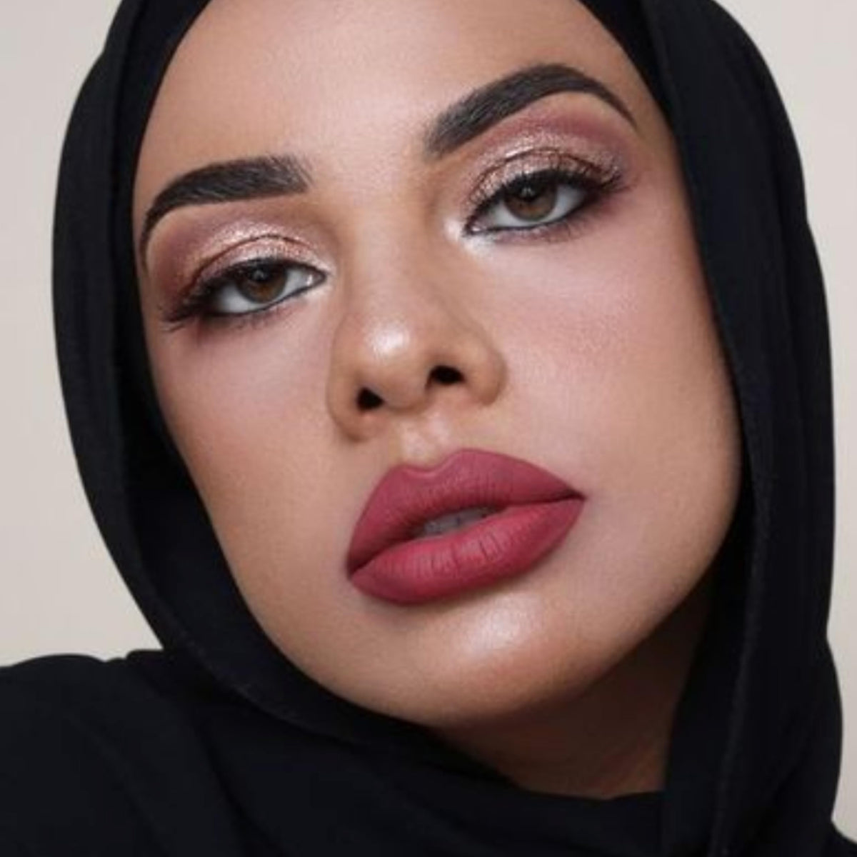 The Lip Bar Nonstop Liquid Matte Lipstick Unimpressed with gloss layering