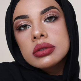 The Lip Bar Nonstop Liquid Matte Lipstick Unimpressed with gloss layering