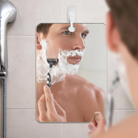 The Shave Well Company X-Large Anti-Fog Shaving Mirror handheld view
