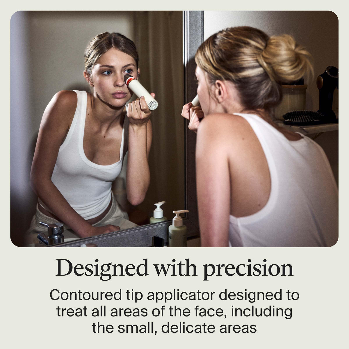 TheraFace Depuffing Wand in use on facial skin