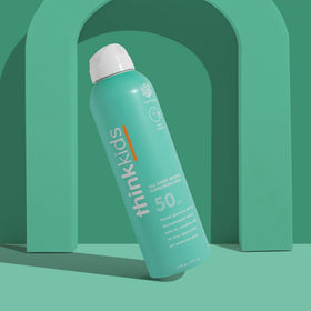 THINK Kids Sunscreen Spray SPF 50+ application on skin