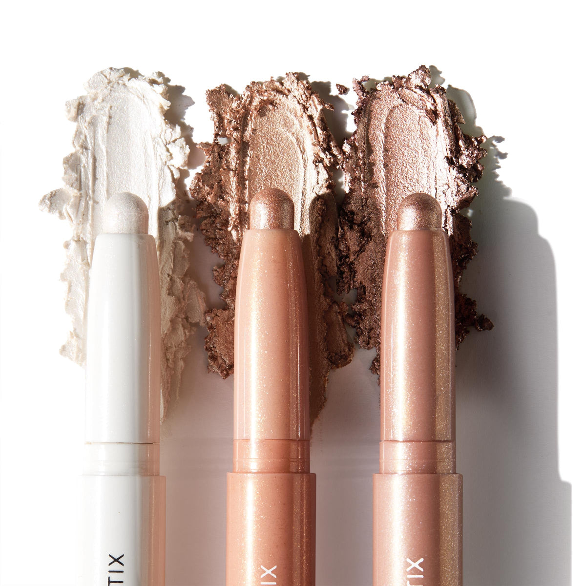 Three cream eyeshadow sticks in various neutral shades