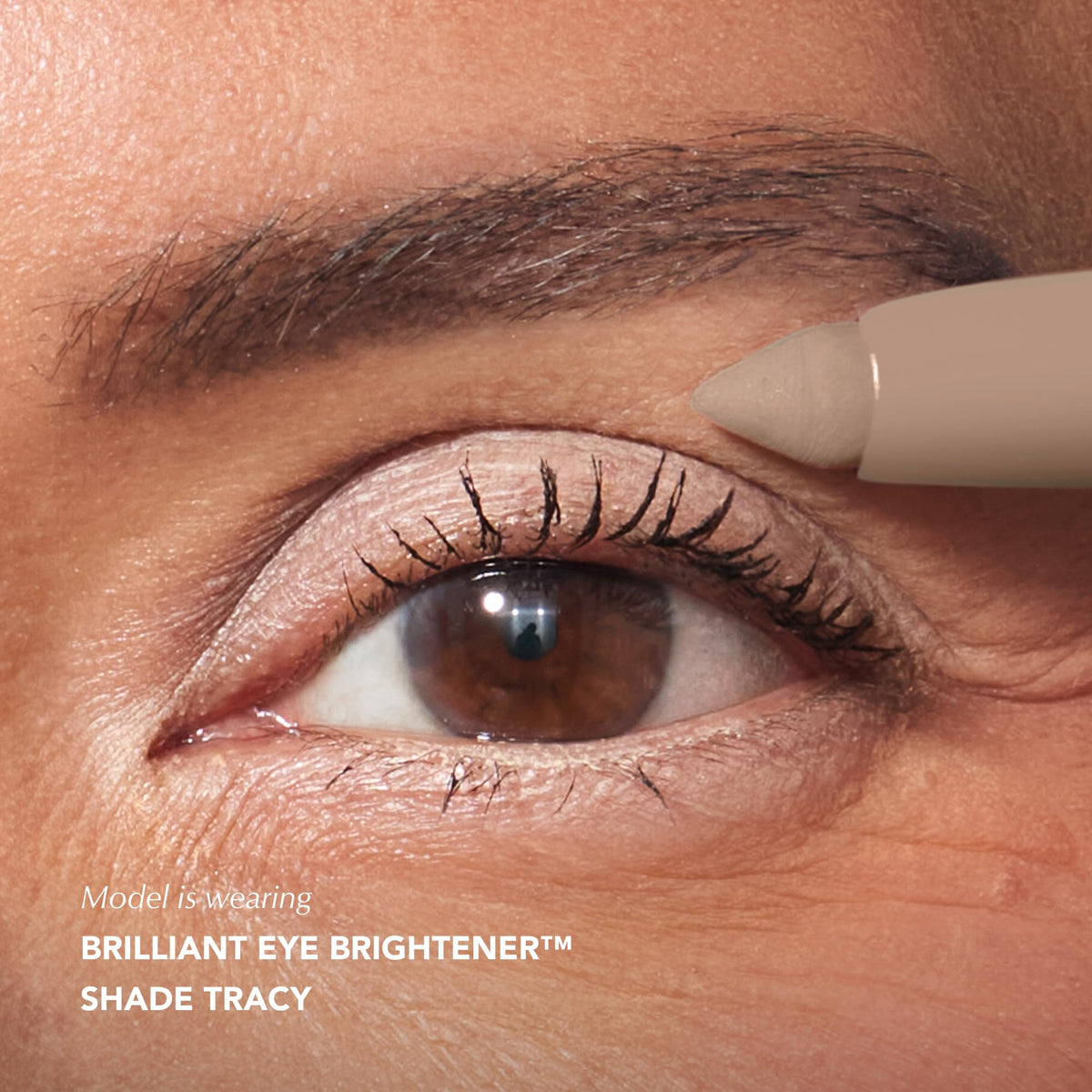 Thrive Causemetics Brilliant Eye Brightener Stick Cool Taupe Matte in hand