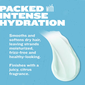 TIGI Recovery Conditioner Travel Mini next to hair styling tools
