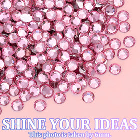 TINKRSTUFF rhinestones showcased in a creative nail art design