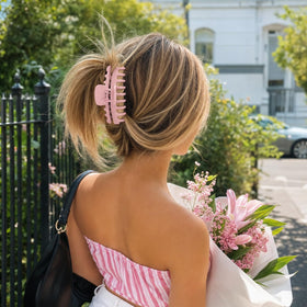 TOCESS Jumbo Hair Claw Clip in Pink, on a vanity