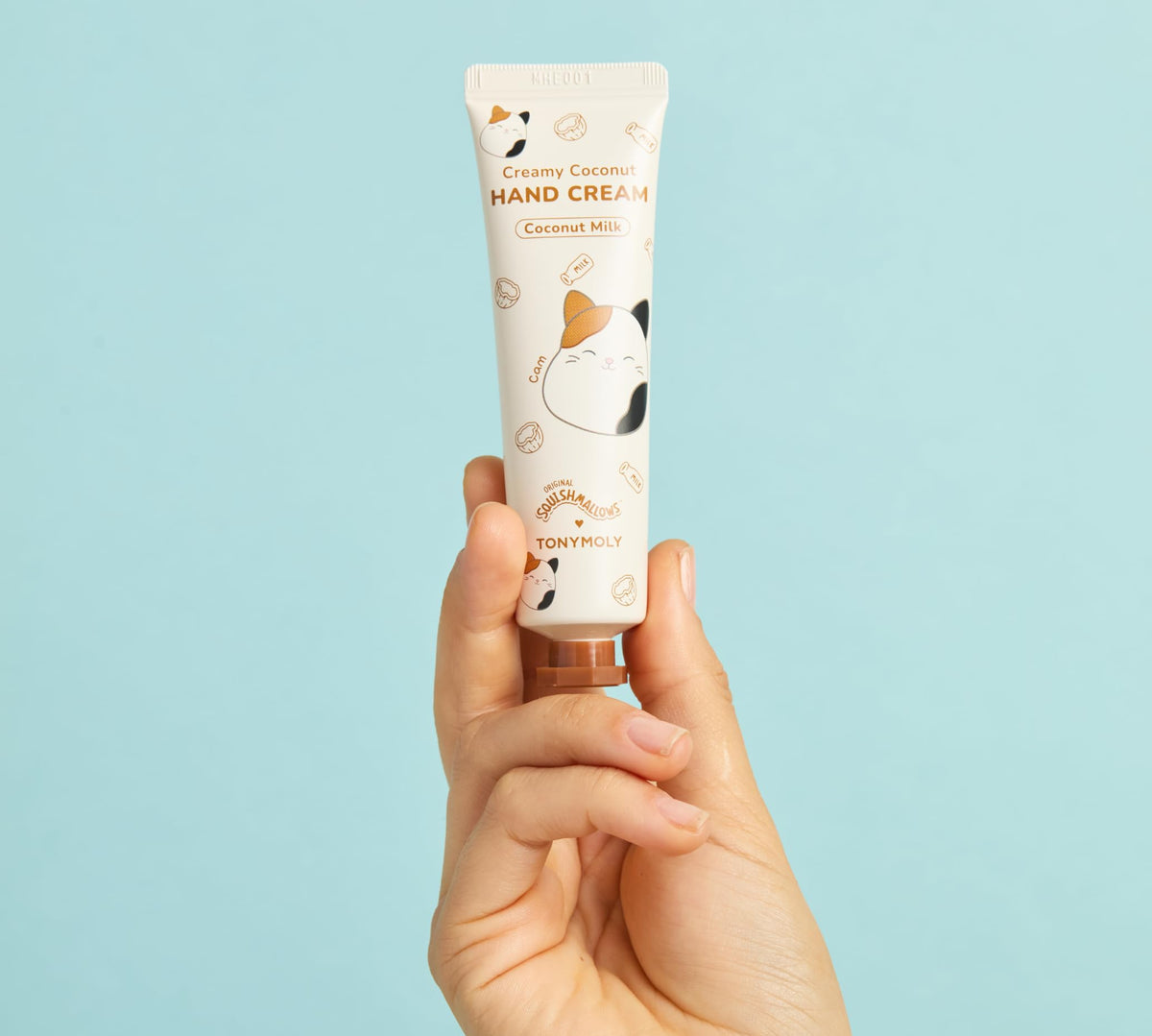 TONYMOLY Frosted Milk Lip Gloss close-up with packaging