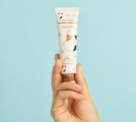 TONYMOLY Frosted Milk Lip Gloss close-up with packaging