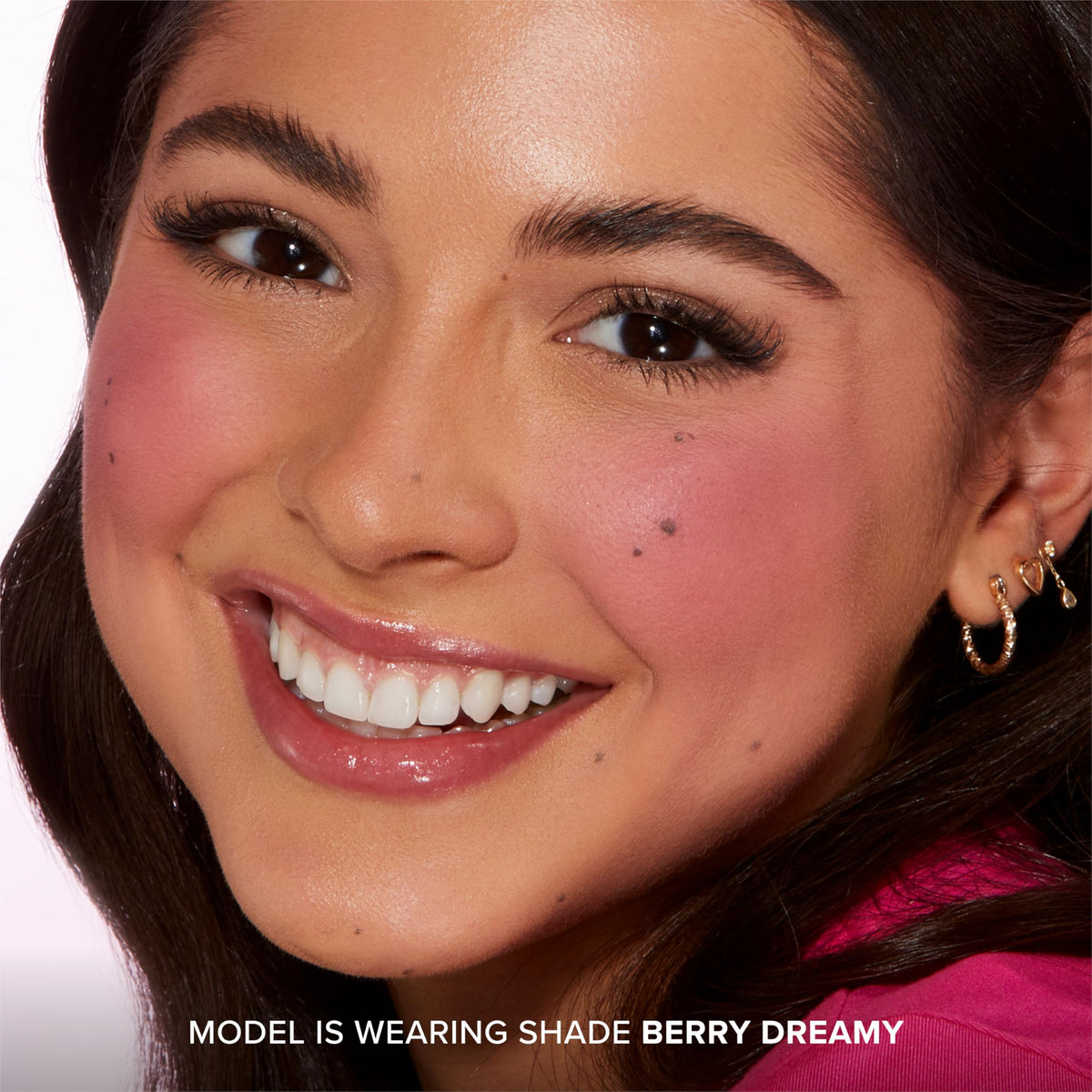 Too Faced Cloud Crush Blurring Blush Berry Dreamy on model cheeks