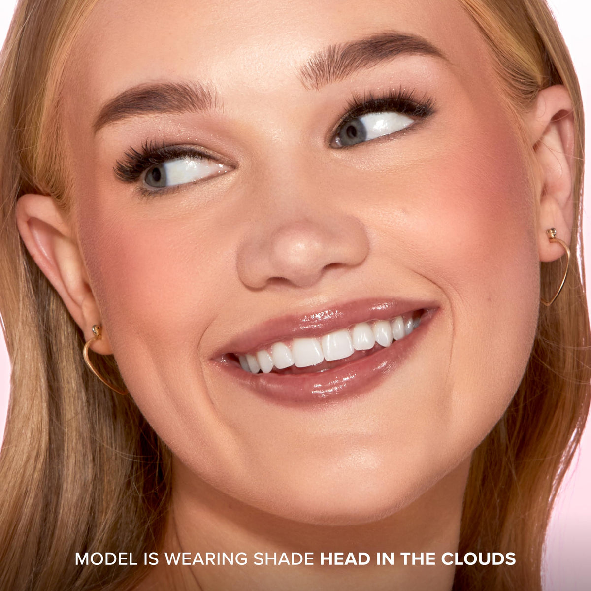 Too Faced Cloud Crush Blurring Blush in hand with natural lighting