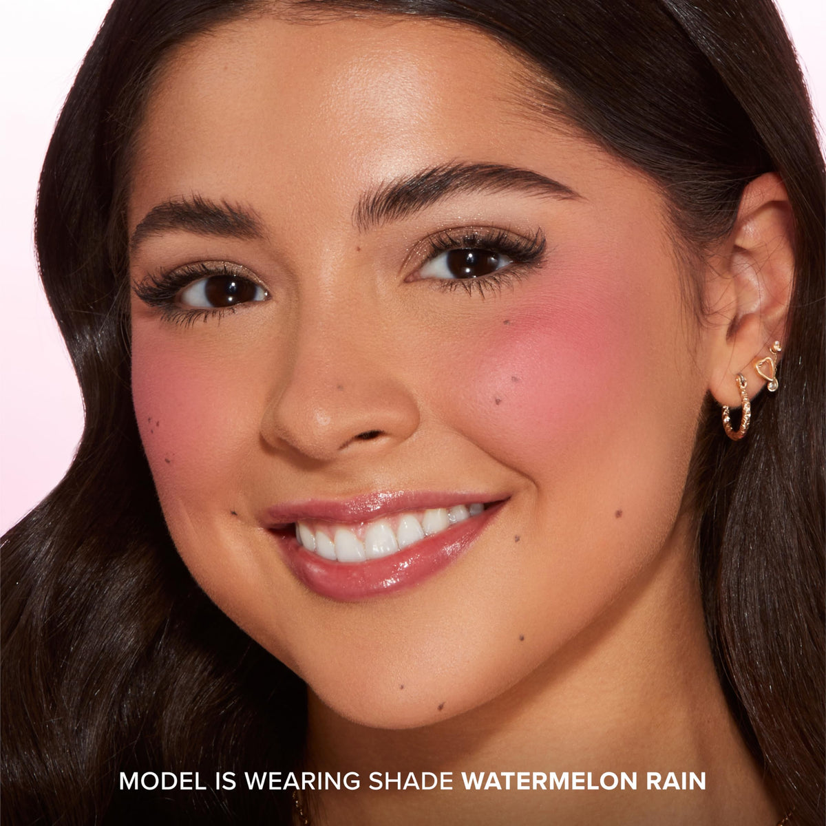 Too Faced Cloud Crush Blurring Blush in use on cheeks