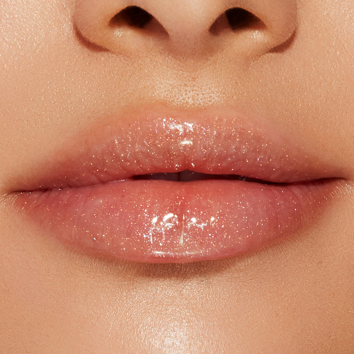 Too Faced Lip Injection Lip Gloss in a makeup bag