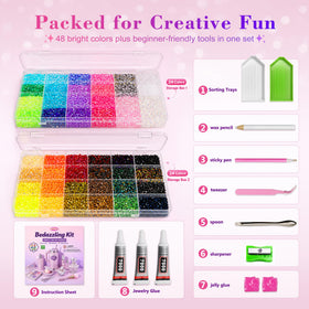 Tools included in Redtwo rhinestones kit: glue, tweezers, and sorting trays