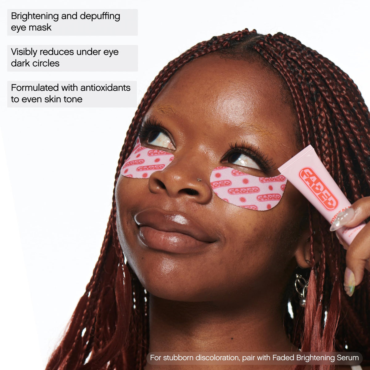 Topicals Faded Brightening Under Eye Masks in use on a person's eyes