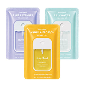 Touchland Blossom Trio travel-size hand sanitizer sprays in Pure Lavender, Vanilla Blossom, and Rainwater scents