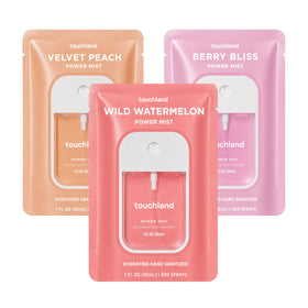 Touchland Juicy Trio Hand Sanitizer Set featuring three spray bottles in Wild Watermelon, Velvet Peach, and Berry Bliss scents