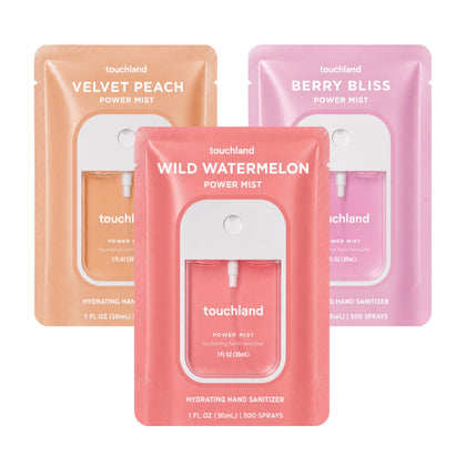 Touchland Juicy Trio Hand Sanitizer Set featuring three spray bottles in Wild Watermelon, Velvet Peach, and Berry Bliss scents
