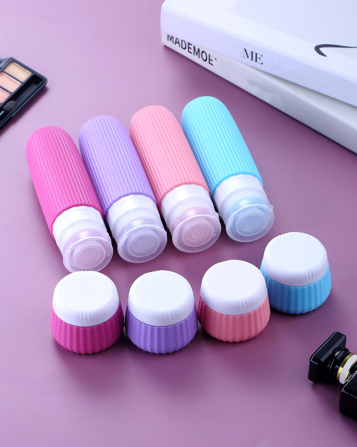 Travel containers for toiletries in a clear makeup bag