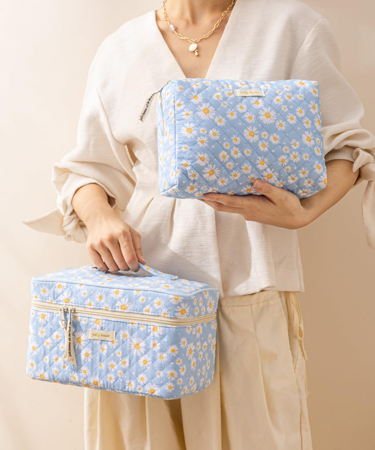 Travel-ready HBselect makeup bags in a suitcase
