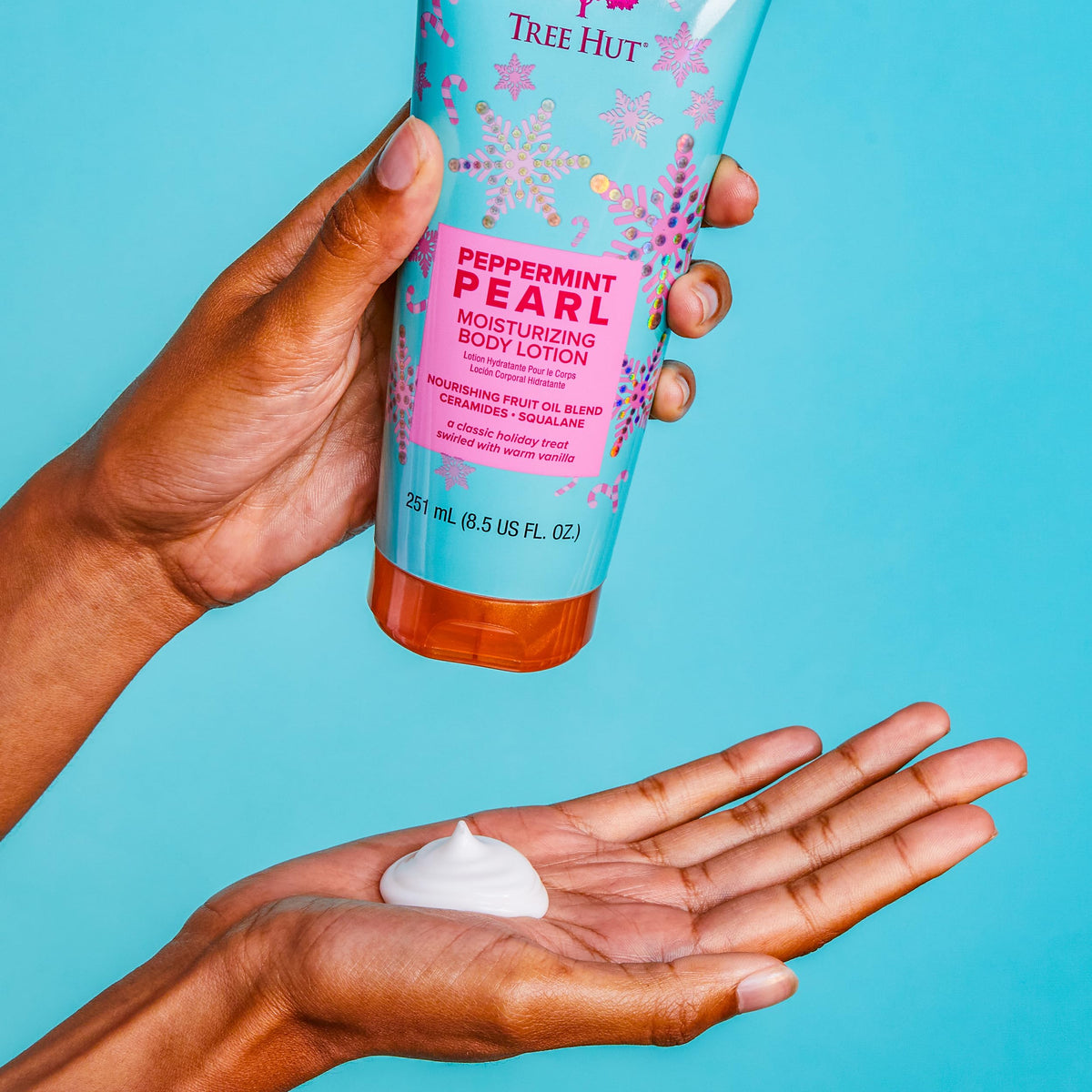 Tree Hut Peppermint Pearl Body Lotion with holiday decorations