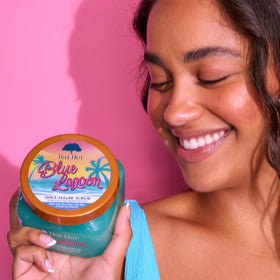 Tree Hut Shea Sugar Scrub Blue Lagoon on bathroom shelf