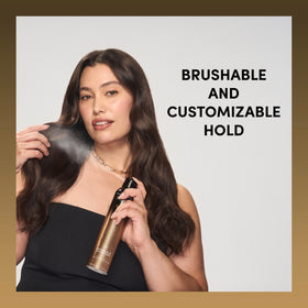TRESemmé A-List Hairspray held in hand against a backdrop