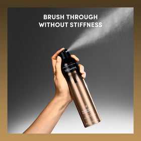 TRESemmé A-List Hairspray with styling products on a vanity